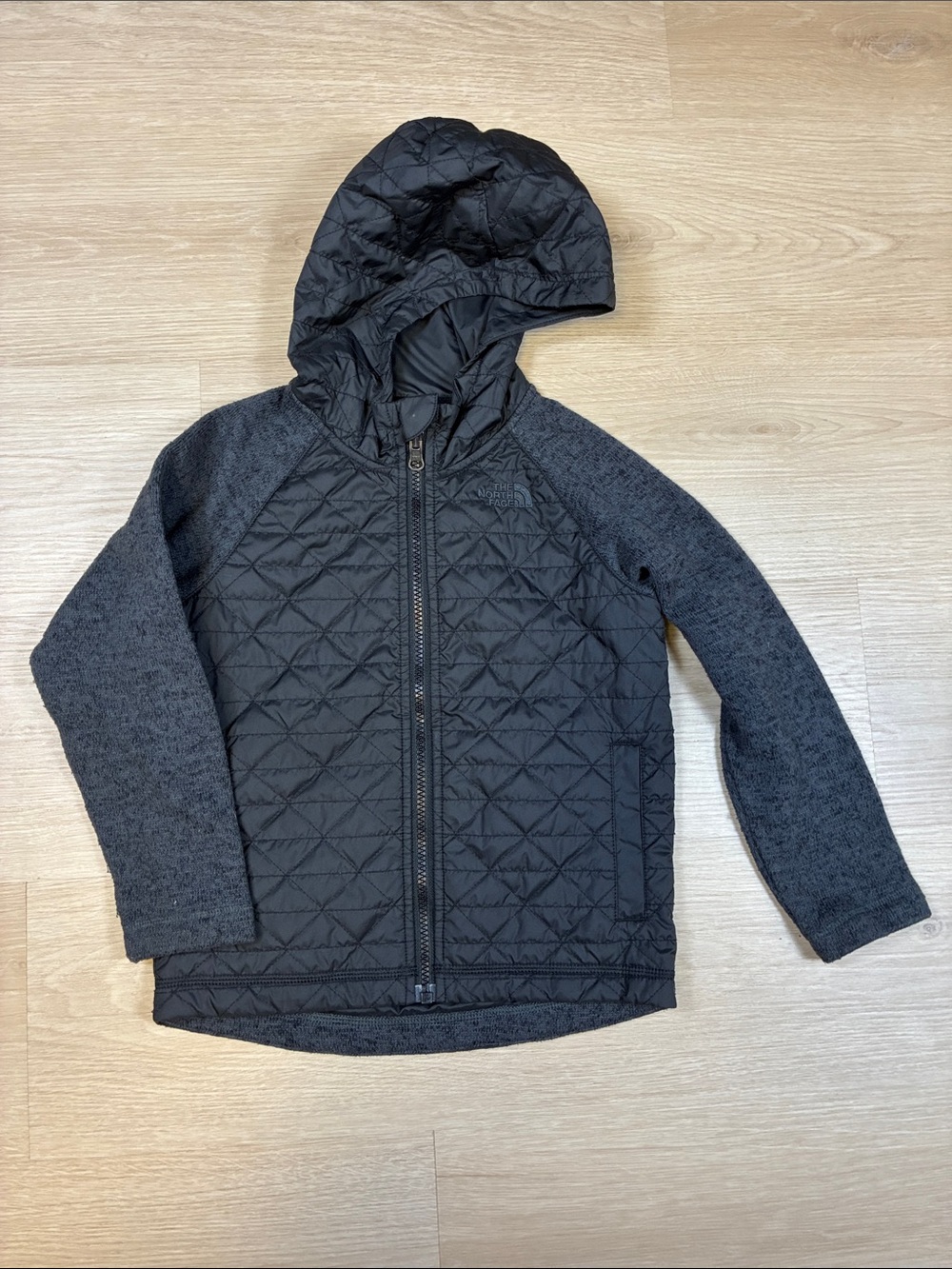 The North Face Kids Black Quilted Hooded Jacket with Knit Sleeves